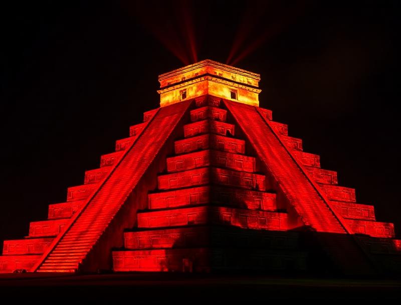 Red and gold projections on temple facade